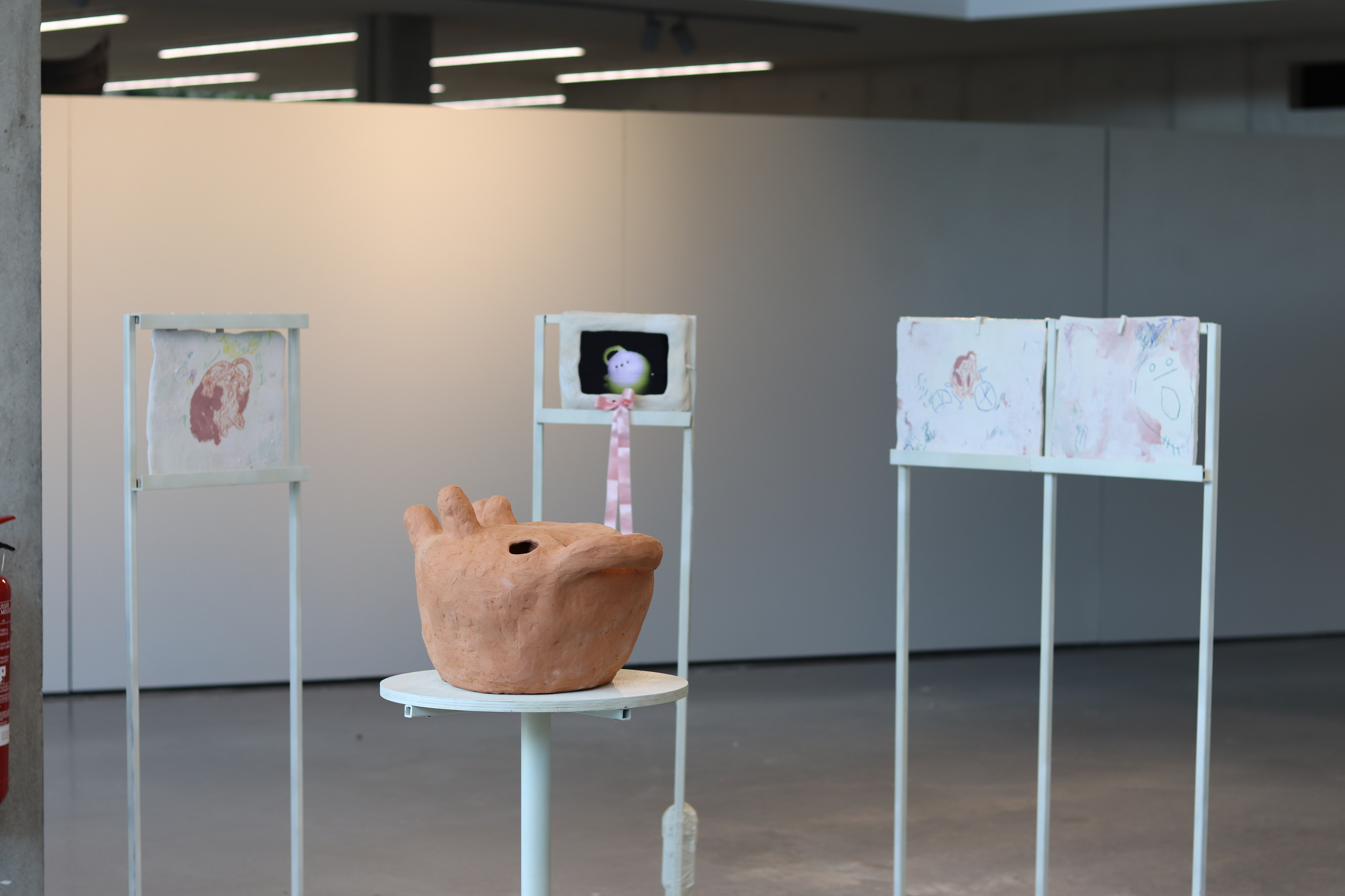 my most recent expo, 3 ceramic slabs, one video in a ceramic sleeve and a big ceramic potato in the middle